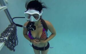 scuba in pool with flooded mask